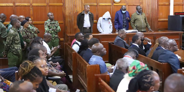 Kenya police officers in dock from left to right sentenced Peter Ngugi Kamau, 20 years, Sylvia Wanjiku Wanjohi, 24 years, Stephen Cheburet Morogo, 30 years and Fredrick Leliman, life sentence at Kenya's Milimani court on Feb. 3, 2023.