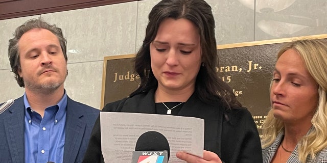 Kirsten Bridegan speaks at a press conference Feb. 13, 2023, after her slain husband Jared Bridegan's accused killer is arraigned. Her brother-in-law, Justin Bridegan, stands to her right.