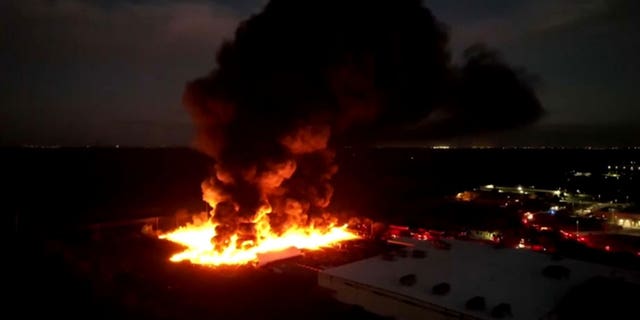 A fire is ablaze and has spread over five acres behind a nursery in Kissimmee, Fl. The fire started with two planters and the spread.