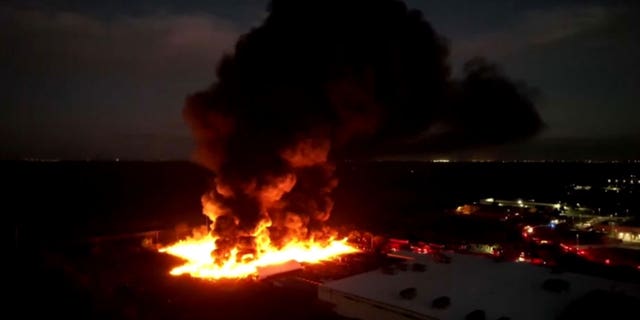 A fire is ablaze and has spread over five acres behind a nursery in Kissimmee, Fl. The fire started with two planters and the spread.