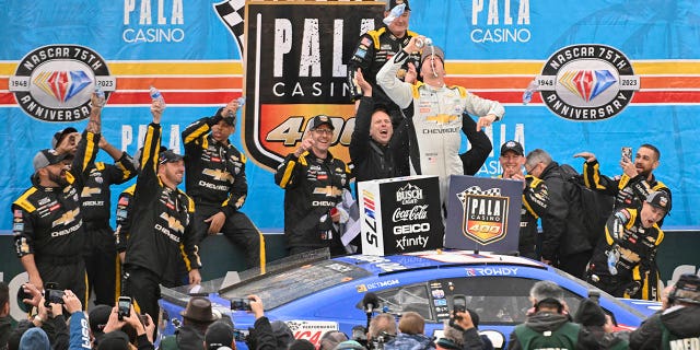 Kyle Busch, driver of the #8 Lucas Oil Chevrolet, celebrates in victory lane after winning the NASCAR Cup Series Pala Casino 400 at Auto Club Speedway on February 26, 2023 in Fontana, California.