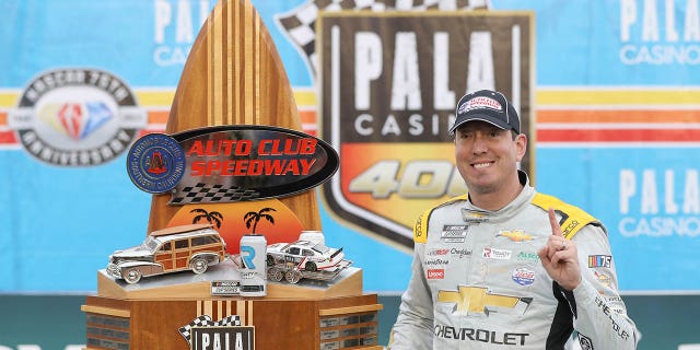 Kyle Busch, driver of the #8 Lucas Oil Chevrolet, celebrates in victory lane after winning the NASCAR Cup Series Pala Casino 400 at Auto Club Speedway on February 26, 2023 in Fontana, California.
