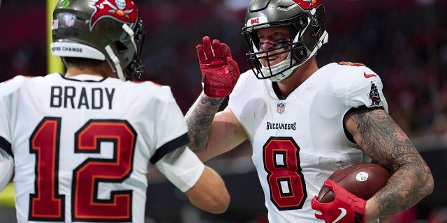 Kyle Rudolph of the Tampa Bay Buccaneers celebrates after scoring a touchdown against the Falcons on January 8, 2023 in Atlanta.