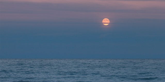 Late evening Moon over Lake Huron, Lake Huron, Michigan. 