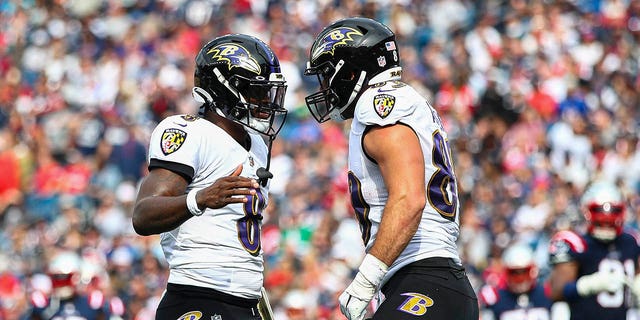 Baltimore Ravens quarterback Lamar Jackson, #8, celebrates with Baltimore Ravens tight end Mark Andrews, #89, after Andrews' touchdown run during the second quarter against the New England Patriots at Gillette Stadium on January 25. September 2022, in Foxborough, USA. Massachusetts.