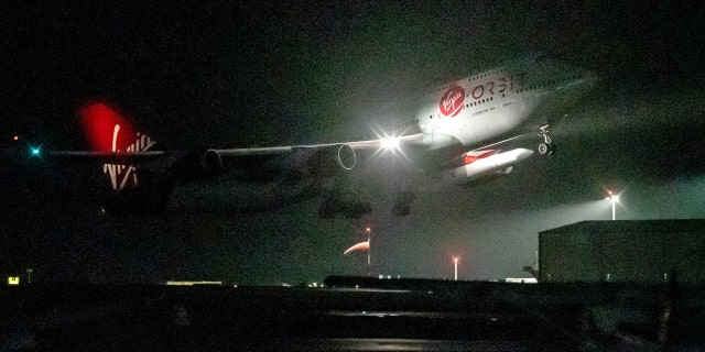 A modified Virgin Atlantic Boeing 747, named Cosmic Girl, takes off from Space Cornwall at Newquay Cornwall Airport on January 9, 2023, aboard Virgin Orbit's LauncherOne rocket. 