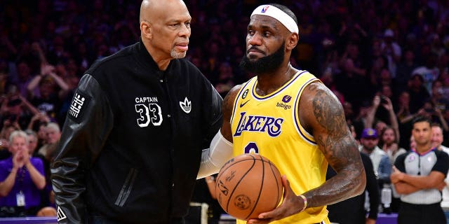 Lakers forward LeBron James meets with Kareem Abdul-Jabbar after breaking the NBA all-time scoring record against the Oklahoma City Thunder at Crypto.com Arena on Feb. 7, 2023, in Los Angeles.