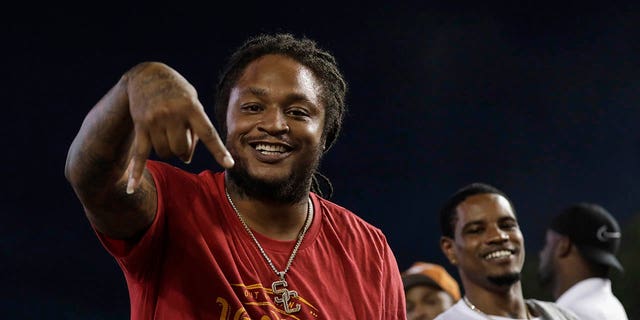 Retired NFL player and former USC Trojans running back LenDale White celebrates during a game against the Texas Longhorns at Darrell K Royal-Texas Memorial Stadium Sept. 15, 2018, in Austin, Texas. 