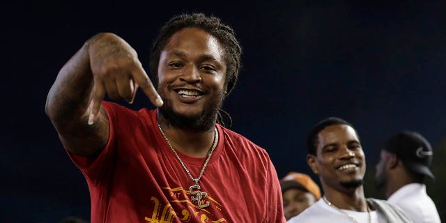 Retired NFL player and former USC Trojans running back LenDale White celebrates during a game against the Texas Longhorns at Darrell K Royal-Texas Memorial Stadium Sept. 15, 2018, in Austin, Texas.