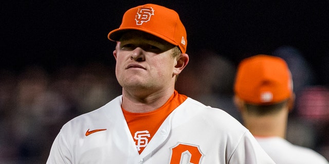 Giants pitcher Logan Webb walks off the field after being relieved during the San Diego Padres game on Aug. 30 2022, at Oracle Park in San Francisco.