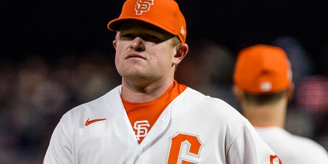 Giants pitcher Logan Webb walks off the field after being relieved during the San Diego Padres game on Aug. 30 2022, at Oracle Park in San Francisco.
