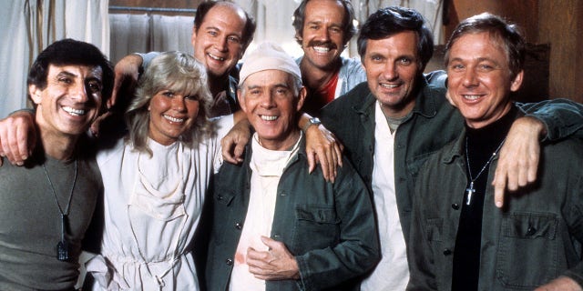 "M*A*S*H" sitcom actors, from left, Jamie Farr, Loretta Swit, David Ogden Stiers, Harry Morgan, Mike Farrell, Alan Alda and William Christopher in a publicity portrait, circa 1978.