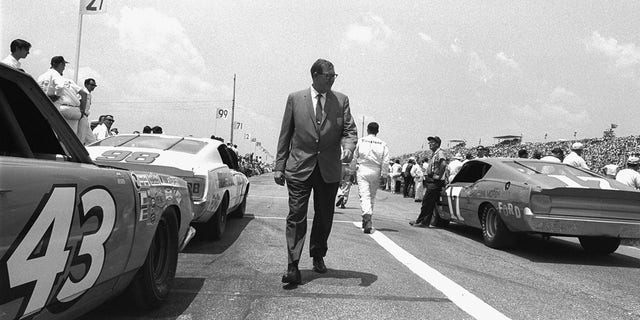 NASCAR founder and president Bill France Sr. walking down the raceway at Daytona International Speedway in Daytona, Florida, on Feb. 16, 1968. 