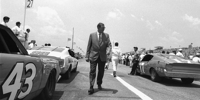 NASCAR founder and president Bill France Sr. walking down the raceway at Daytona International Speedway in Daytona, Florida, on Feb. 16, 1968. 