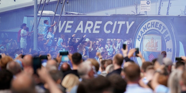 Fans welcome Manchester City players before the start of the match against Aston Villa in Manchester, England on Sunday, May 22, 2022.