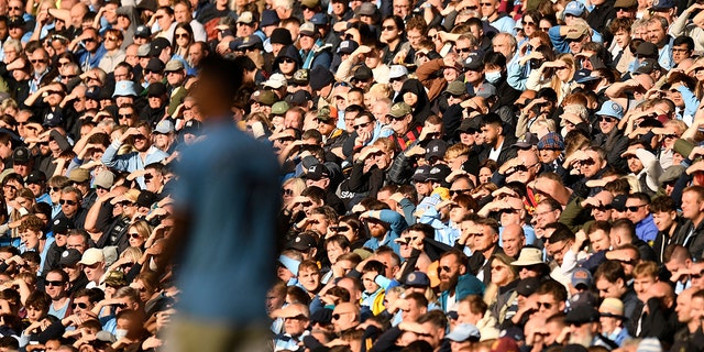 Fans watch the action during the English Premier League match between Manchester City and Southampton at the Etihad Stadium in Manchester, England, on Oct. 8, 2022.