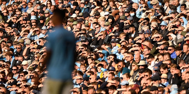 Fans watch the action during the English Premier League match between Manchester City and Southampton at the Etihad Stadium in Manchester, England, on Oct. 8, 2022.