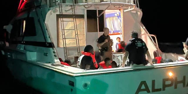 Authorities detain illegal immigrants off Hutchinson Island, Florida.
