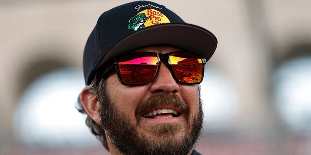 Martin Truex Jr., driver of the #19 Bass Pro Shops Toyota, looks on prior to the NASCAR Clash at the Coliseum at Los Angeles Memorial Coliseum on February 05, 2023 in Los Angeles, California