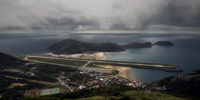 A view from the 670-foot summit of Mt. Bi looks down on the airport's single runway jutting out into into the sea on Beigan in the Matsu island group, off northern Taiwan, on Aug. 22, 2012.