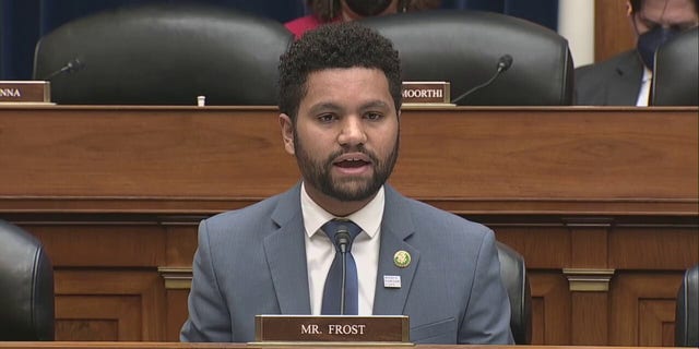 Maxwell Frost with his name tag in front of him