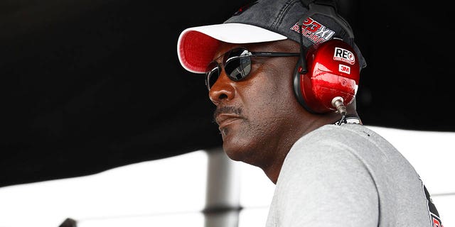 NBA Hall of Famer Michael Jordan and co-owner of 23XI Racing watches from the 23XI Racing pit box during the NASCAR Go Bowling Cup Series at The Glen at Watkins Glen International on August 8, 2021 , in Watkins Glen, New York.