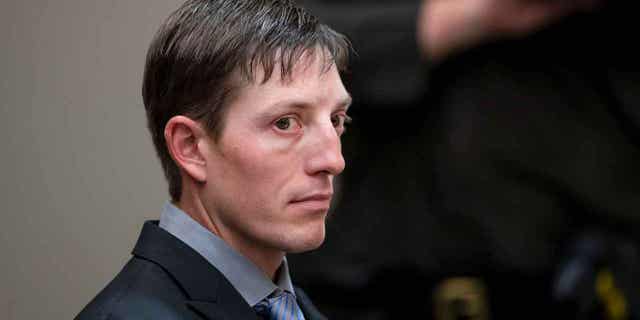 Ex-Grand Rapids Police Officer Christopher Schurr appears for a court hearing in Grand Rapids, Michigan, on Oct. 26, 2022. On Monday, Jan. 9, 2023, attorneys for Schurr asked a judge to dismiss the case. The judge denied the request.