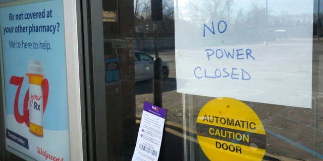 A no power closed sign is displayed at a Walgreens store in Detroit, Friday, Feb. 24, 2023. 