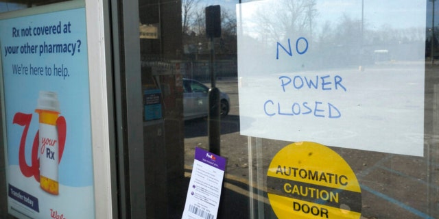 A no power closed sign is displayed at a Walgreens store in Detroit, Friday, Feb. 24, 2023.