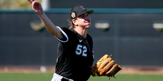 Chicago White Sox starting pitcher Mike Clevinger (52) works during a spring training baseball practice, Wednesday, Feb. 15, 2023, in Phoenix. 