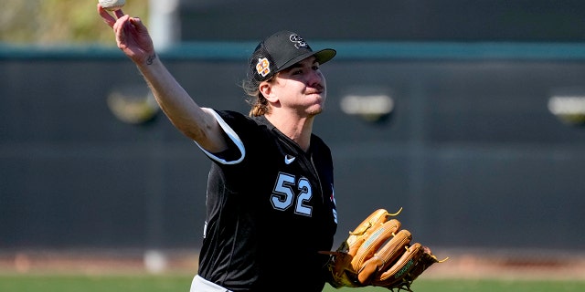 Chicago White Sox starting pitcher Mike Clevinger (52) works during a spring training baseball practice, Wednesday, Feb. 15, 2023, in Phoenix.