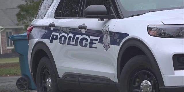 A police vehicle blocks the entrance to former Vice President Mike Pence's Indiana home, Friday, Feb. 10, 2023.