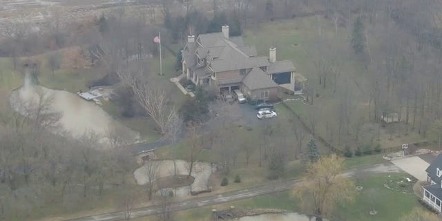 Former Vice President Mike Pence's Indiana home is seen from the air as a police vehicle is seen in the driveway, Friday, Feb. 10, 2023.