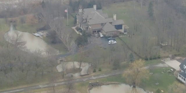 Former Vice President Mike Pence's Indiana home is seen from the air as a police vehicle is seen in the driveway, Friday, Feb. 10, 2023.