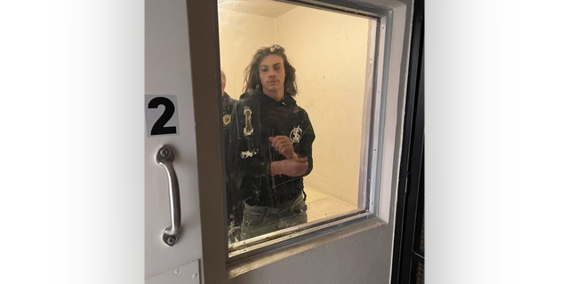 Miles Pfeffer in Philadelphia police custody in a holding cell. 