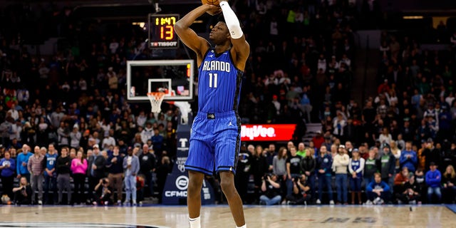 Mo Bamba #11 of the Orlando Magic shoots the ball against the Minnesota Timberwolves in the first quarter of the game at Target Center on February 03, 2023 in Minneapolis, Minnesota.