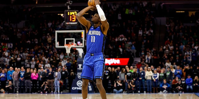 Mo Bamba #11 of the Orlando Magic shoots the ball against the Minnesota Timberwolves in the first quarter of the game at Target Center on February 03, 2023 in Minneapolis, Minnesota.