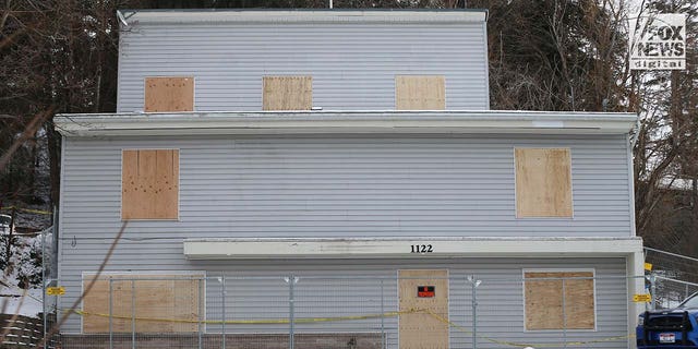 The house where four college students were brutally stabbed to death is boarded up and surrounded by security fencing on Thursday, February 23, 2023 in Moscow, Idaho.