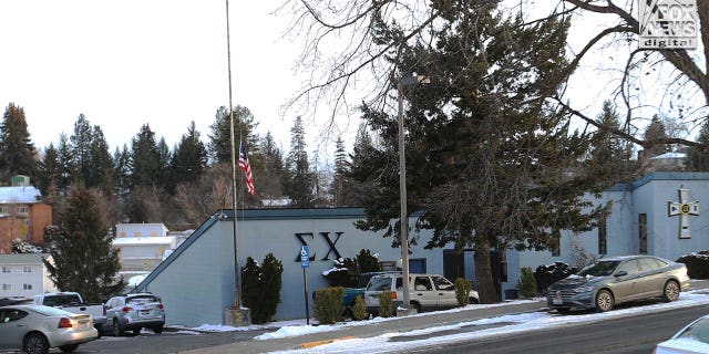 The University of Idaho's Sigma Chi fraternity house, where Ethan Chapin was a member, stands in the foreground of the boarded-up King Road crime scene in Moscow, Idaho, on Feb. 23, 2023.