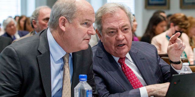 Jim Griffin and Dick Harpootlian speak to each other during the trial.