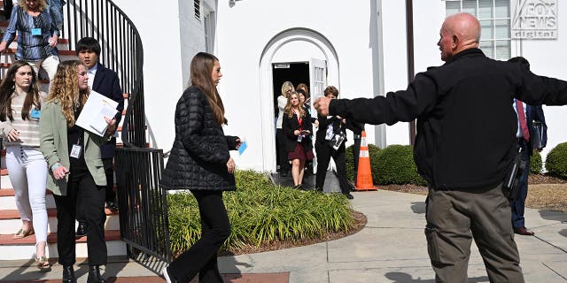 The Colleton County Courthouse is evacuated in response to a bomb threat during Alex Murdaugh’s double murder trial in Walterboro, S.C., Feb. 8, 2023.