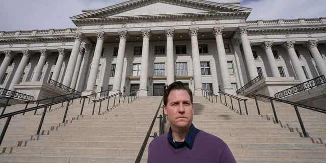 Sean Bliemiller poses for a photo in front of the Utah State Capitol on February 15, 2023 in Salt Lake City.  Blimiller said he began magic mushroom therapy to treat resistant depression after becoming disillusioned with traditional antidepressants.  Legislators across the US are weighing proposals to legalize psychedelic mushrooms.