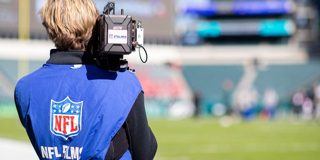 An NFL Films cameraman films before a game between the Chicago Bears and the Philadelphia Eagles at Lincoln Financial Field on November 3, 2019 in Philadelphia.