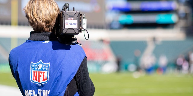 An NFL Films cameraman films before a game between the Chicago Bears and the Philadelphia Eagles at Lincoln Financial Field on November 3, 2019 in Philadelphia.