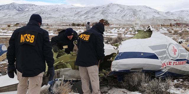 NTSB investigators documenting nan wreckage of a Pilatus PC-12 airplane astatine nan clang tract successful Dayton, Nevada. 