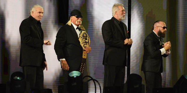 WWE Hall of Fame inductees Scott Hall, Hulk Hogan, Kevin Nash and Sean Waltman greet fans during WrestleMania 37 at Raymond James Stadium in Tampa, Fla., April 10, 2021.