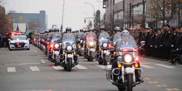NYPD motorbike police ride along the funeral route for slain officer, Adeed Fayaz in Brooklyn, NY, Thursday, February 9, 2023.