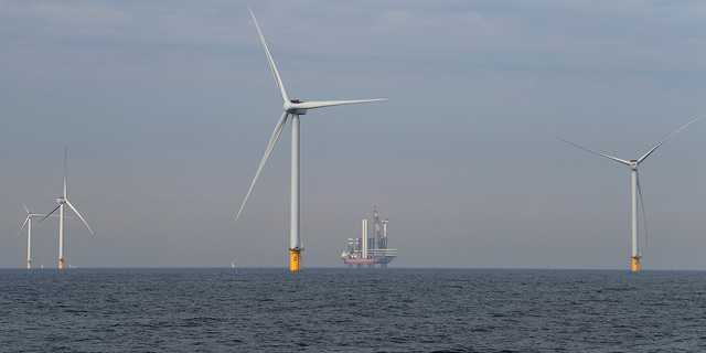 Wind turbines are seen at the North Sea in Scheveningen, Netherlands.