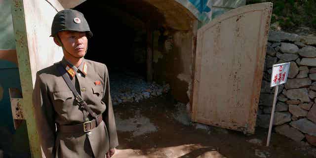 A guard stands at the entrance of the north tunnel at North Korea's nuclear test site shortly before it was blown up on May 24, 2018. Human rights advocates on Feb. 21, 2023, urged South Korea to offer exposure tests to hundreds of North Korean escapees who had previously lived near the country’s nuclear testing ground.