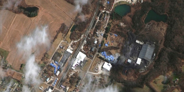This satellite image provided by Maxar Technologies shows an overview of the aftermath of the Norfolk Southern train derailment on Wednesday, Feb. 15, 2023, in East Palestine, Ohio. About 50 cars derailed in a fiery, mangled mess on the outskirts of East Palestine on Feb. 3. 